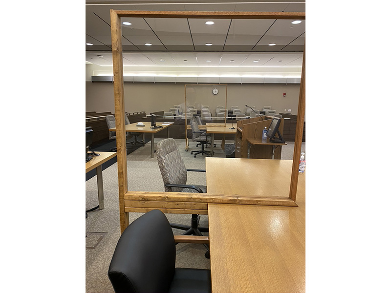 In courtrooms, plastic shields have been placed on the bench, by the judge, and by court clerks and, in some cases, at counsel tables to allow an attorney and his or her client to sit side by side