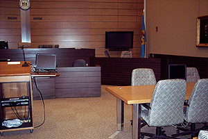 Photo of plasma monitor and computer monitors in courtroom