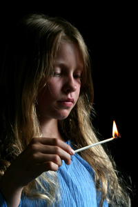 A kid with a lit match